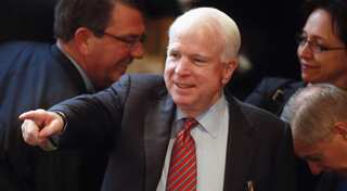 Senator McCain meets Ukraine president, says Russia must 'pay the price' for cyber attacks