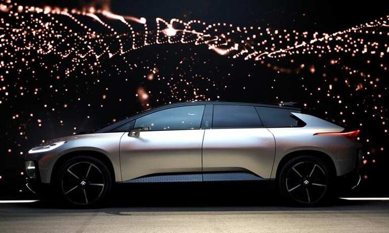 The Faraday Future FF 91 electric car is displayed at the event.