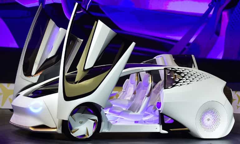 The Toyota Concept-i vehicle is revealed during the Toyota press conference at the trade show.