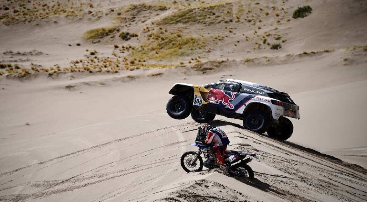 French driver Sebastien Loeb and co-driver Daniel Elena of Monaco and Yamaha's Japanese biker Shinnosuke Kazama