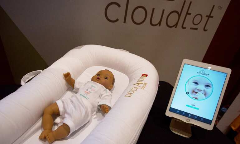 A DockATot Deluxe smart baby bed and app are shown at ShowStoppers.