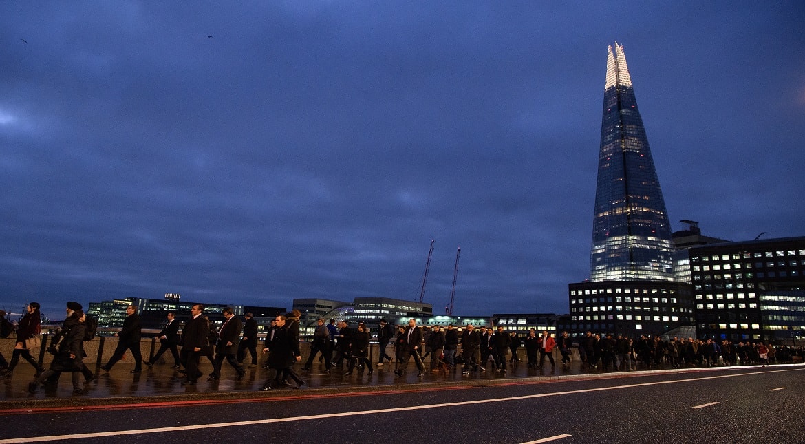 Commuters walk across London Bridge as a planned tube strike on the London underground network takes place  in London, England.