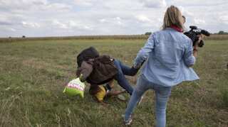 Hungarian camerawoman sentenced for tripping, kicking migrants