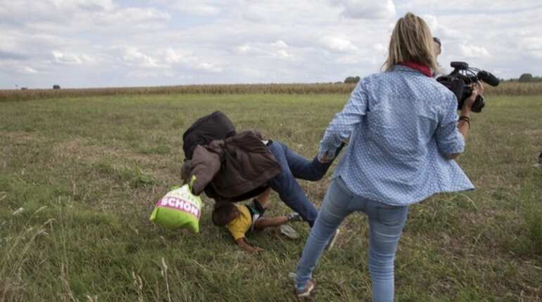 Hungarian camerawoman sentenced for tripping, kicking migrants