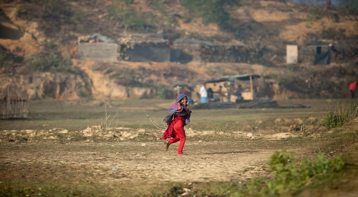 A Rohingya girl runs through the Balu Kali refugee camp in Cox's Bazar, Bangladesh.