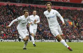 Liverpool's title bid suffers after Swansea record stunning victory