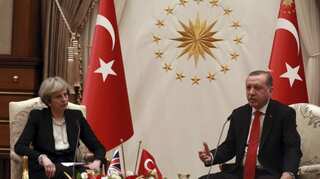 Theresa  May woos Turkey for trade, presses on human rights