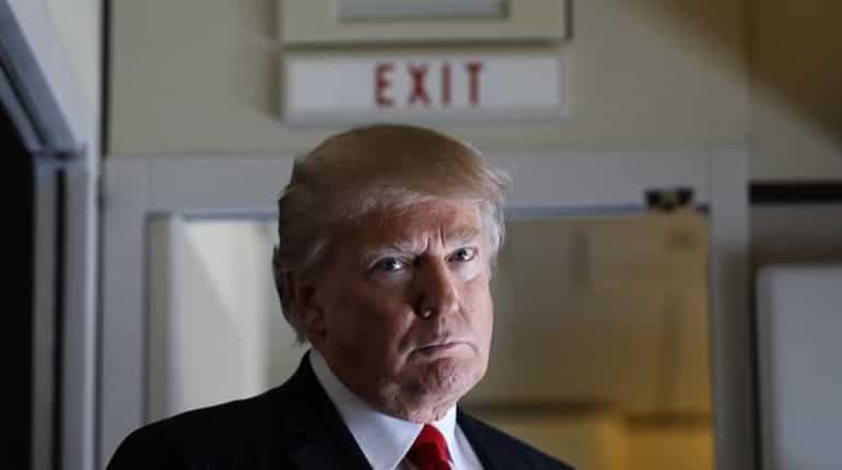 Aboard Air Force One: Trump mulls 'brand new order' to revise travel ban