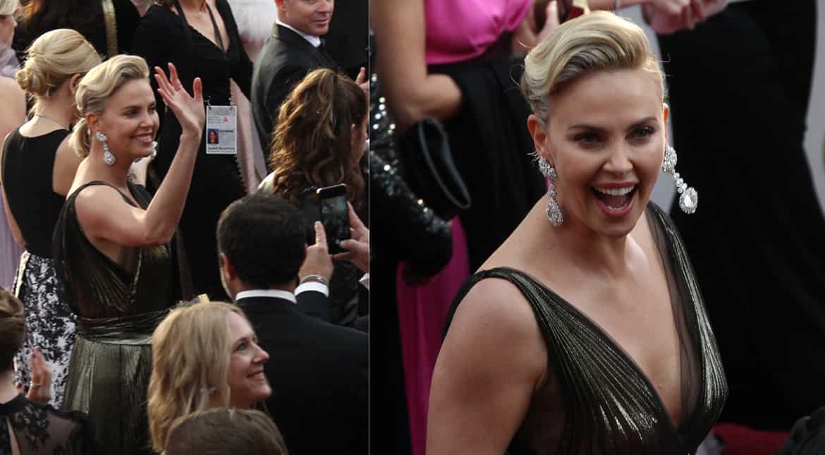 American actress Charlize Theron stunned in a plunging shimmering gown.