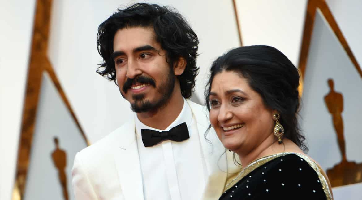 Indian-origin actor Dev Patel was all smiles as he walked the red carpet with his mother Anita.