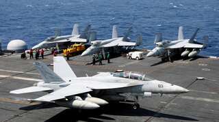 US fighter jets, helicopters fly over South China Sea