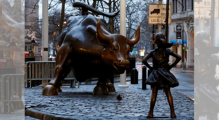 Wall Street bull meets 'fearless girl' on International Women's Day