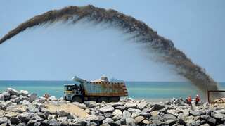 Debt-ridden Sri Lanka to scale back port deal with China