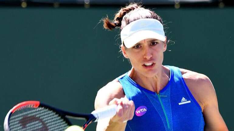 Kerber holds off Parmentier to advance at Indian Wells
