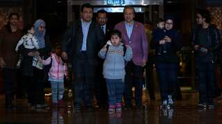 Freed Malaysians arrive home from North Korea after Kim row