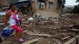 Colombia starts to bury 273 landslide victims, even as search continues