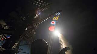US fires 59 missiles at Syria air base