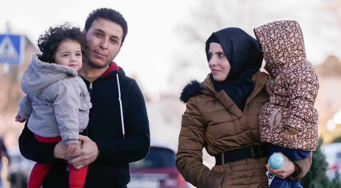 Insight: Syrian refugees must buy travel papers - from Assad