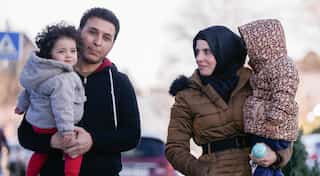 Insight: Syrian refugees must buy travel papers - from Assad