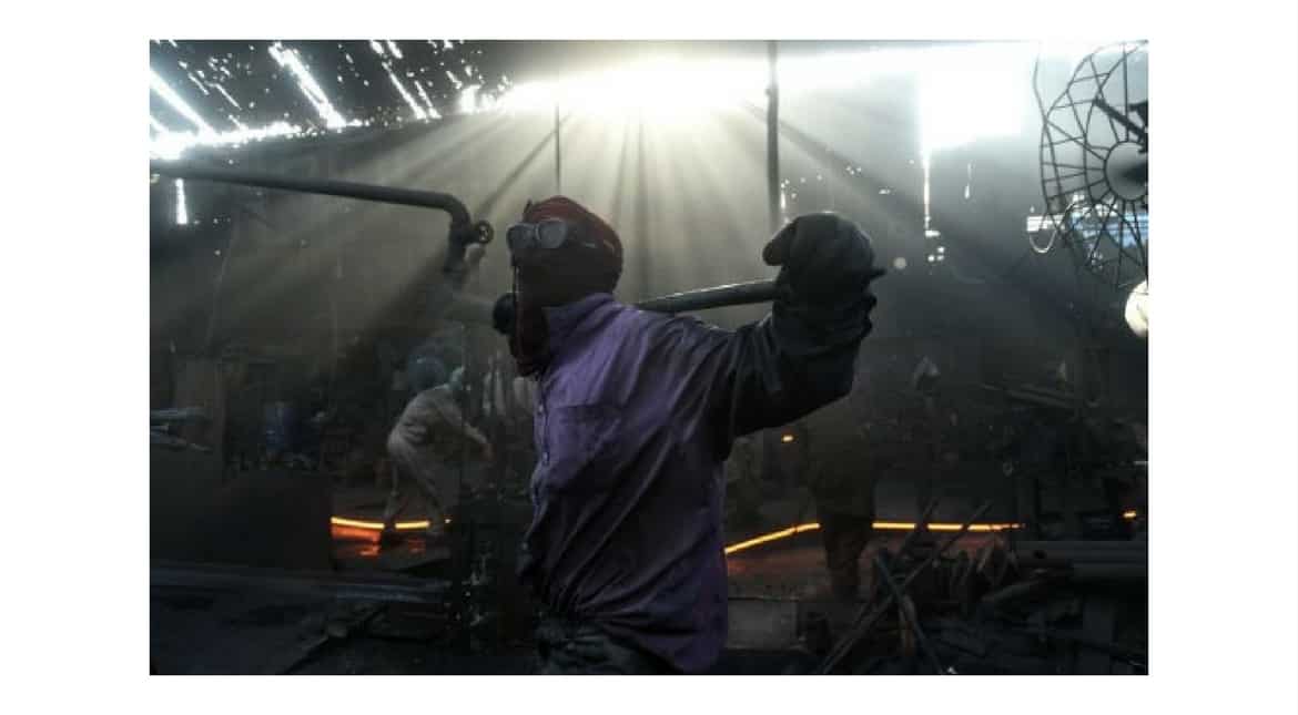 Pakistani labourer work at an iron factory on the eve of International Workers' Day in Lahore on April 29, 2017.