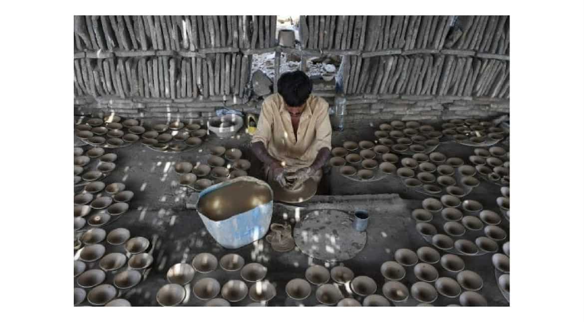 A Pakistani labourer makes clay dishes at a factory in Karachi on April 30, 2017, ahead of International Labour day.