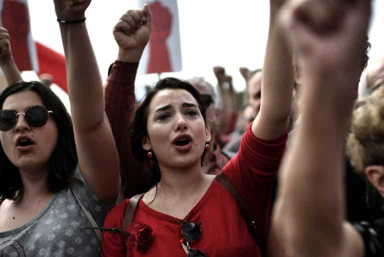 Members of the Greek communist labour union (PAME) gesture as they demonstrate in central Athens during the May Day celebrations on May 1, 2017
