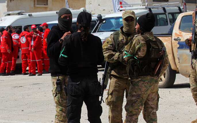 Syria rebels depart eastern Ghouta town on government buses in first surrender
