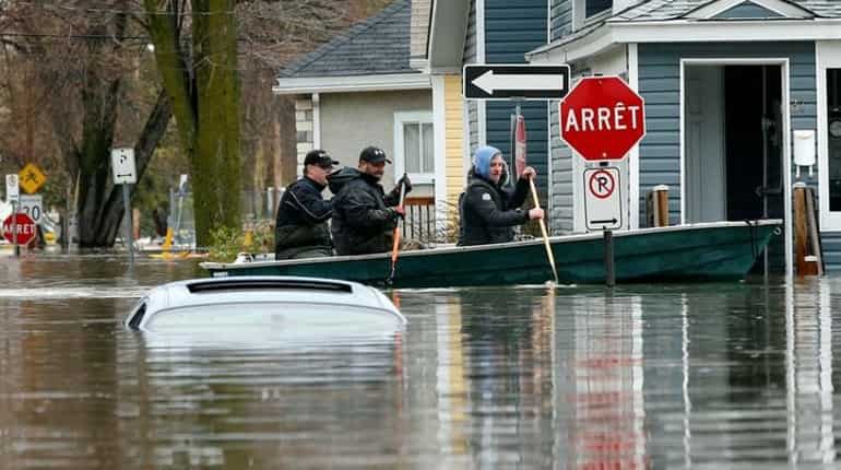 Canada's Quebec battles floods; police search for toddler, man swept away