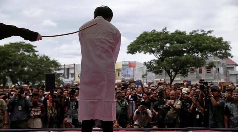 Two men publicly caned in Indonesia for having gay sex