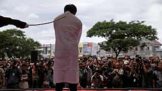 Two men publicly caned in Indonesia for having gay sex