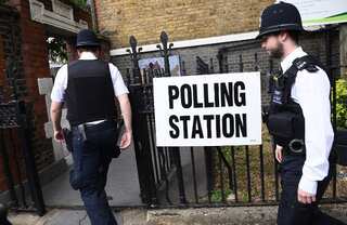 In shadow of terror, Britons vote in key election