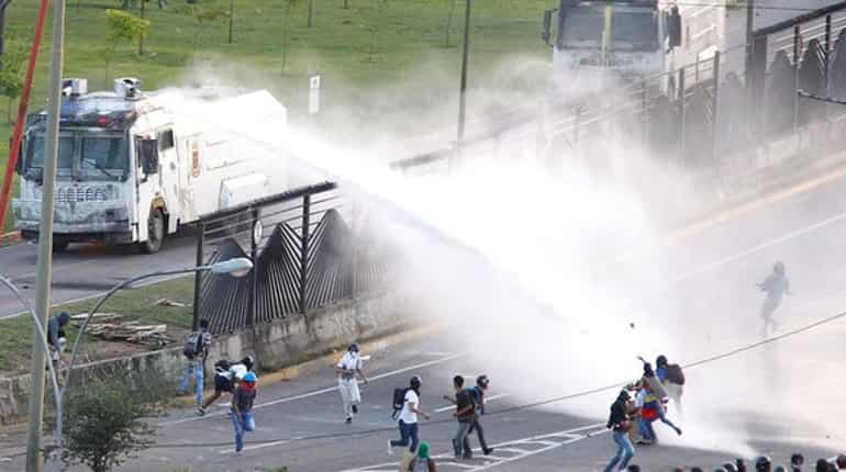 Venezuelan troops fire on protesters at airbase, 1 killed
