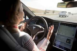 Tesla, others seek ways to ensure drivers keep their hands on the wheel