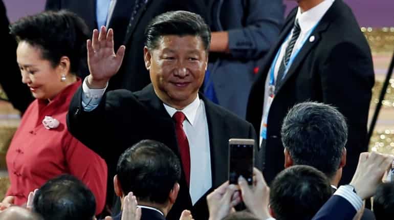 China's Xi talks tough on Hong Kong as tens of thousands call for democracy