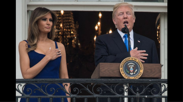 Donald Trump sings the national anthem with First Lady