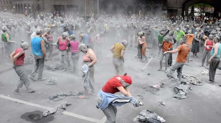 Activists rip off their outer grey coverings