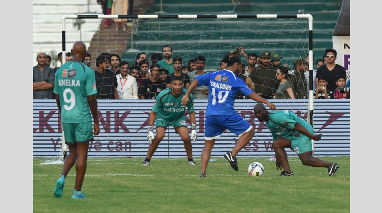 Former player for FC Barcelona Brazilian Ronaldinho (2-R) on the field