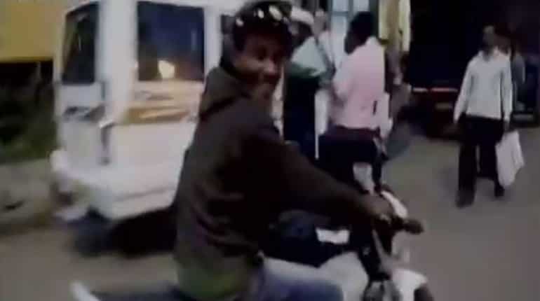 WATCH: Allegedly drunk man runs off with cop's bike, cap