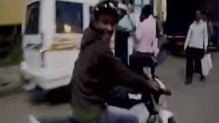 WATCH: Allegedly drunk man runs off with cop's bike, cap