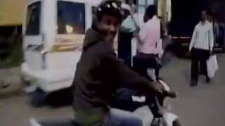 WATCH: Allegedly drunk man runs off with cop's bike, cap