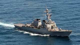 US warship sails near disputed South China Sea islands: Official