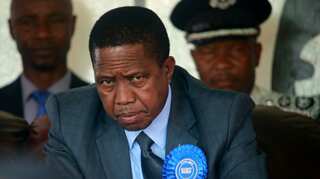 Debt-ridden Zambia votes in closely contested polls