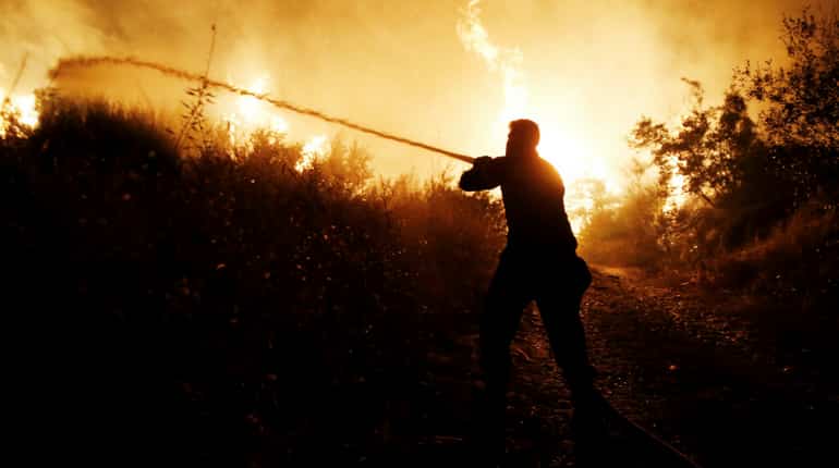 Firefighters battle spreading wildfire near Athens Firefighters battle spreading wildfire near Athens