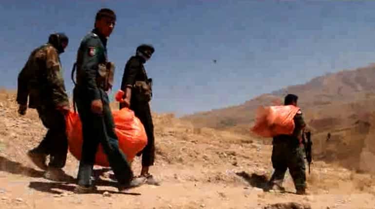 Afghan police discover mass graves after village attack Afghan police discover mass graves after village attack