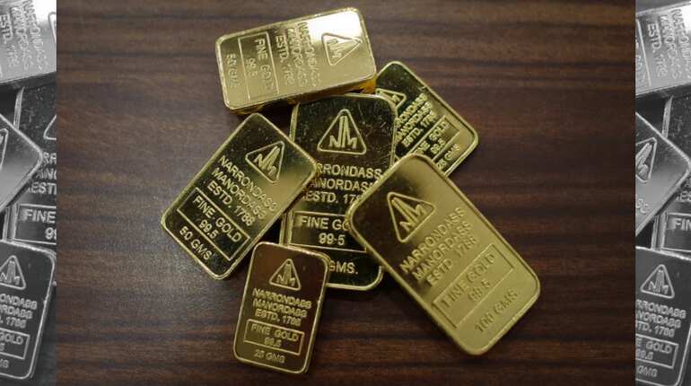 Gold edges up after gaining on softer dollar