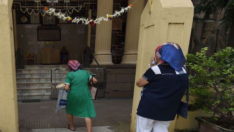 Indian Parsis arrive at a Fire Temple to offer prayers during Navroze, the Parsi New Year, in Mumbai on August 17, 2017.
