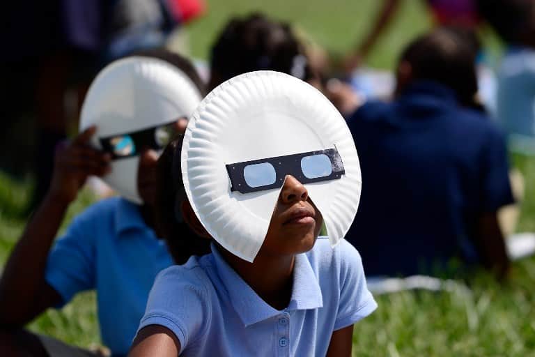 Students at the Jennings School District view the solar eclipse