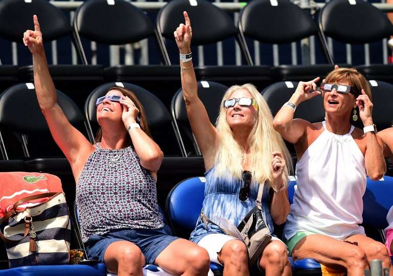 Happy faces looking at the sun