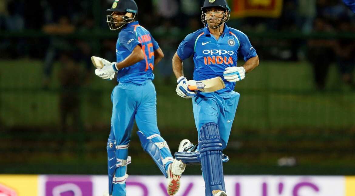 India's MS Dhoni and Bhuvneshwar Kumar run between wickets