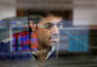 Sensex, Nifty fall as virus cases surge; banks slip
